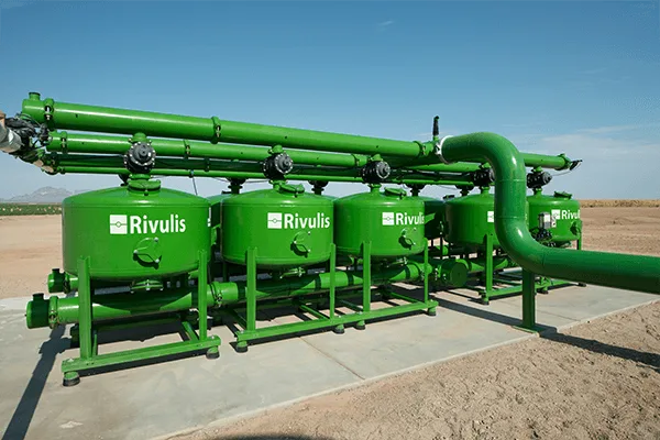 Rivulis media filters - bank of four Rivulis-branded media filter vessels with manifold, from the Rivulis product lobby