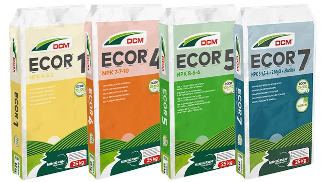 DCM ECOR® range of 100% organic fertilisers in MINIGRAN® Technology, four 25 kg professional bags side by side: DCM ECOR® 1 (NPK 9-5-3), DCM ECOR® 4 (NPK 7-7-10), DCM ECOR® 5 (NPK 8-5-6) and DCM ECOR® 7 (NPK 5-1,5-4 + 2 MgO + Bacillus)