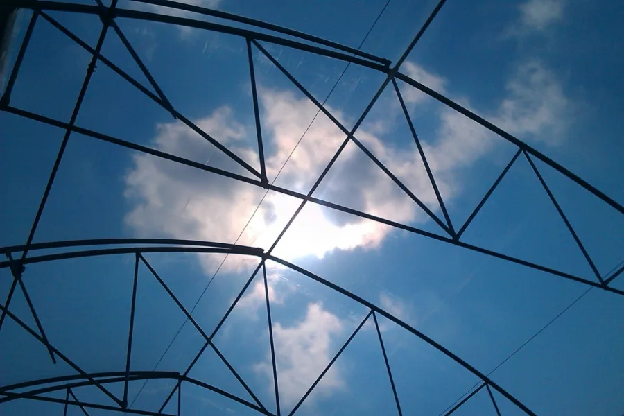 KRITIFIL New 8-layer greenhouse films - EVO AC films with long-lasting anti-drip & anti-mist (hero image on the EVO AC page: the film seen from inside the greenhouse against the sun)